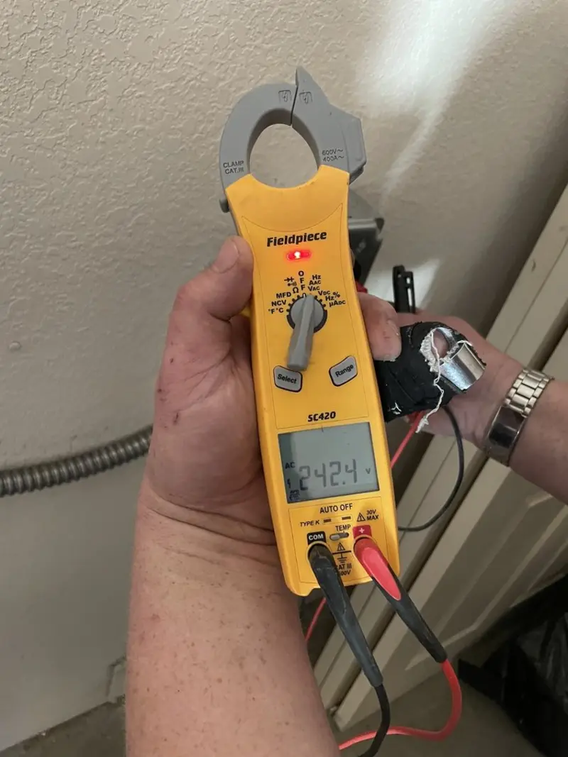 Voltage testing with clamp meter during Generator Installation in Midway City